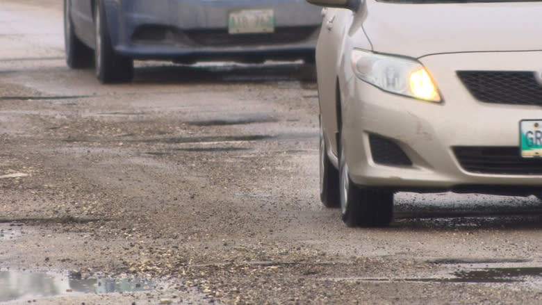 'It's like a war zone': businesses describe potholes on St. Matthews Avenue