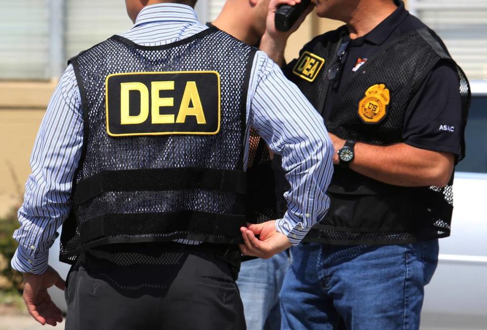 In this June 13, 2016, file photo, Drug Enforcement Administration agents arrive on the scene of a fatal shooting. Joe Burbank/AP