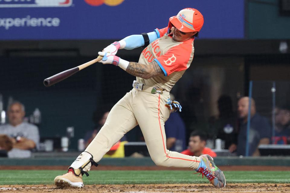 Jarren Duran of the Boston Red Sox hits a two-run home run in the fifth inning of the MLB All-Star game, July 16, 2024, in Arlington, Texas.