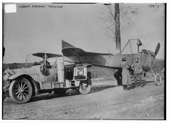 A German car towing a plane in WWI