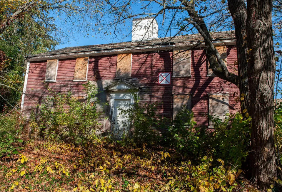 The John Hemenway House on Pleasant Street in Framingham was built in 1741. It has fallen into disrepair, but its current owner says he hopes to renovate it into a multifamily property.
