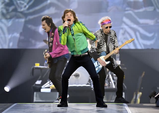 <p>ERIC LALMAND/BELGA MAG/AFP via Getty</p> Ronnie Wood, Mick Jagger and Keith Richards perform in 2022.