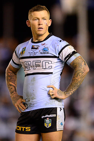 Perennial NRL bad-boy Todd Carney was sacked by Cronulla Sharks after a shocking picture of him apparently urinating into his own mouth appeared online.