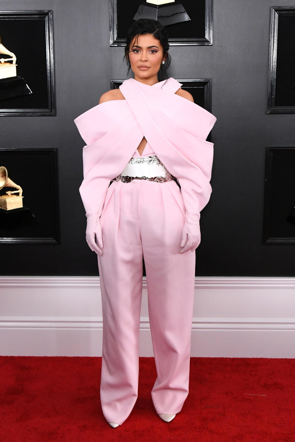 At the Grammys on Feb. 10, Kylie Jenner&rsquo;s halter top flared out into pink gloves and oversize pants. (Photo: Jon Kopaloff via Getty Images)