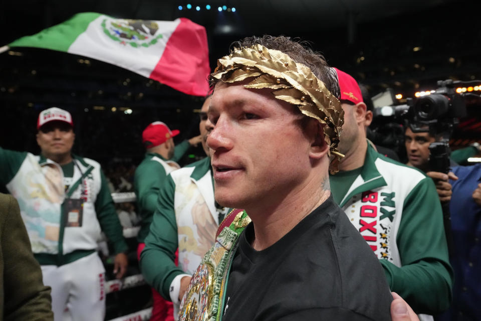 Canelo Alvarez of Mexico celebrates after defeating John Ryder of Britain in their super middleweight title boxing match at the Akron Stadium in Guadalajara, Mexico, Saturday, May 6, 2023. (AP Photo/Moises Castillo)