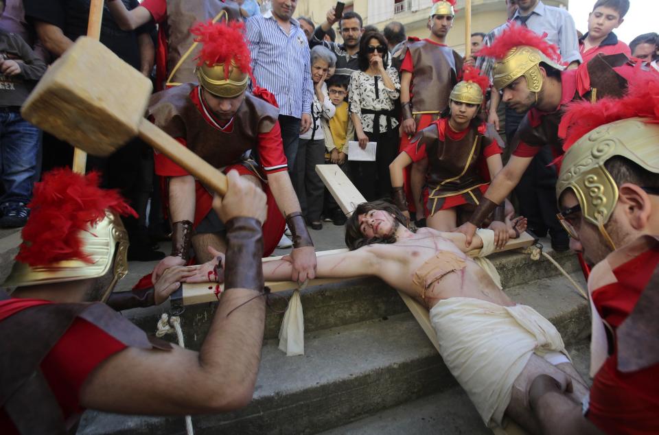 Lebanese Christians take part in a re-enactment of the crucifixion of Jesus Christ on Good Friday beside Mar Joseph Chruch, Dhour Sarba