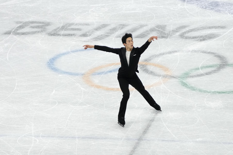 Nathan Chen, of the United States, competes during the men's singles short program team event in the figure skating competition at the 2022 Winter Olympics, Friday, Feb. 4, 2022, in Beijing. Chen, who was born and raised in the U.S. by Chinese immigrants, is competing for the U.S. team as a medal contender in men’s singles figure skating. (AP Photo/Natacha Pisarenko)