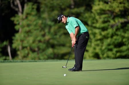 Aug 25, 2016; Farmingdale, NY, USA; Patrick Reed putts on the 10th green during the first round of The Barclays golf tournament at Bethpage State Park - Black Course. Mandatory Credit: Eric Sucar-USA TODAY Sports