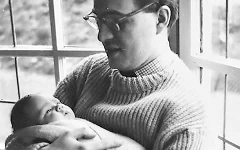 A month-old David Thomas in his father’s arms in 1959 - Credit: Courtesy of David Thomas