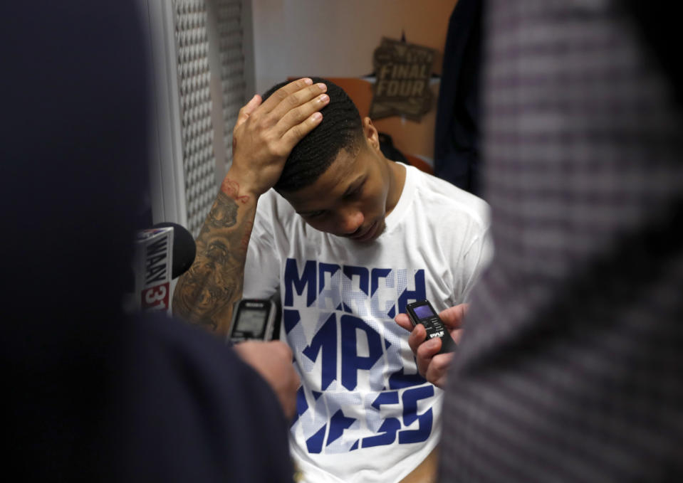 Auburn's J'Von McCormick talks to reporters in the locker room after the team's 63-62 loss to Virginia in the semifinals of the Final Four NCAA college basketball tournament, Saturday, April 6, 2019, in Minneapolis. (AP Photo/Jeff Roberson)