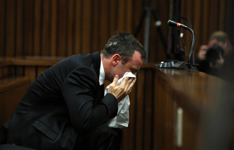 Oscar Pistorius weeps as he listens to evidence by a pathologist in court in Pretoria, South Africa, Monday, April 7, 2014. Pistorius is charged with murder for the shooting death of his girlfriend Reeva Steenkamp, on Valentines Day 2013. (AP Photo/Themba Hadebe, Pool)