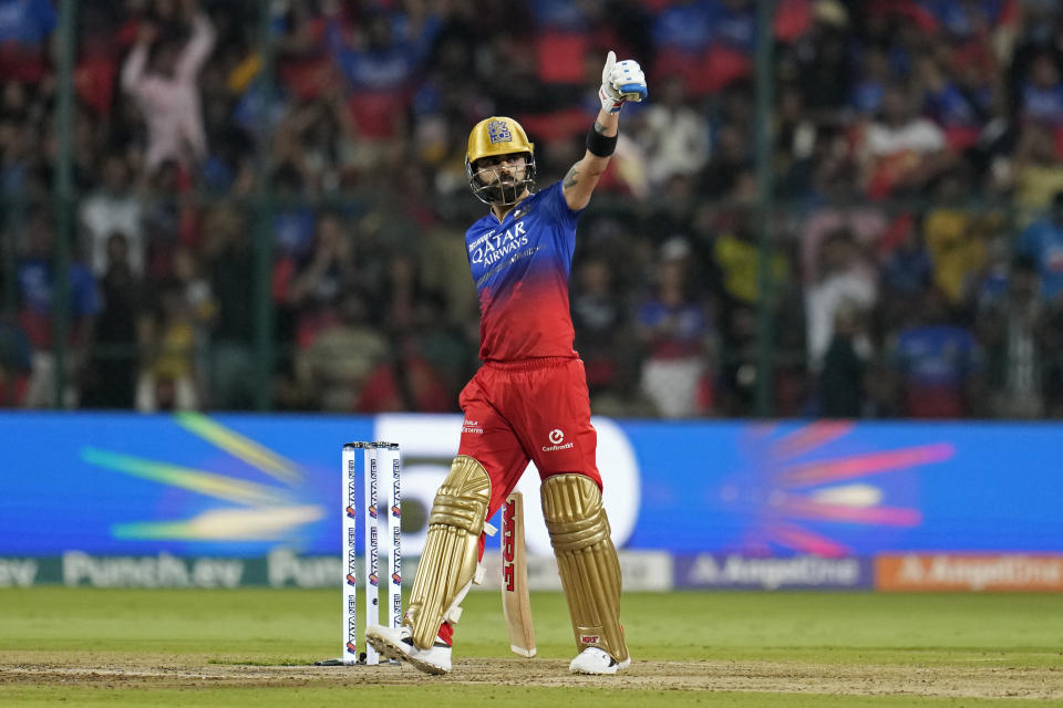 Royal Challengers Bengaluru's Virat Kohli celebrates scoring fifty runs during the Indian Premier League cricket match between Royal Challengers Bengaluru and Kolkata Knight Riders in Bengaluru, India, Friday, March 29, 2024. (AP Photo/Aijaz Rahi)