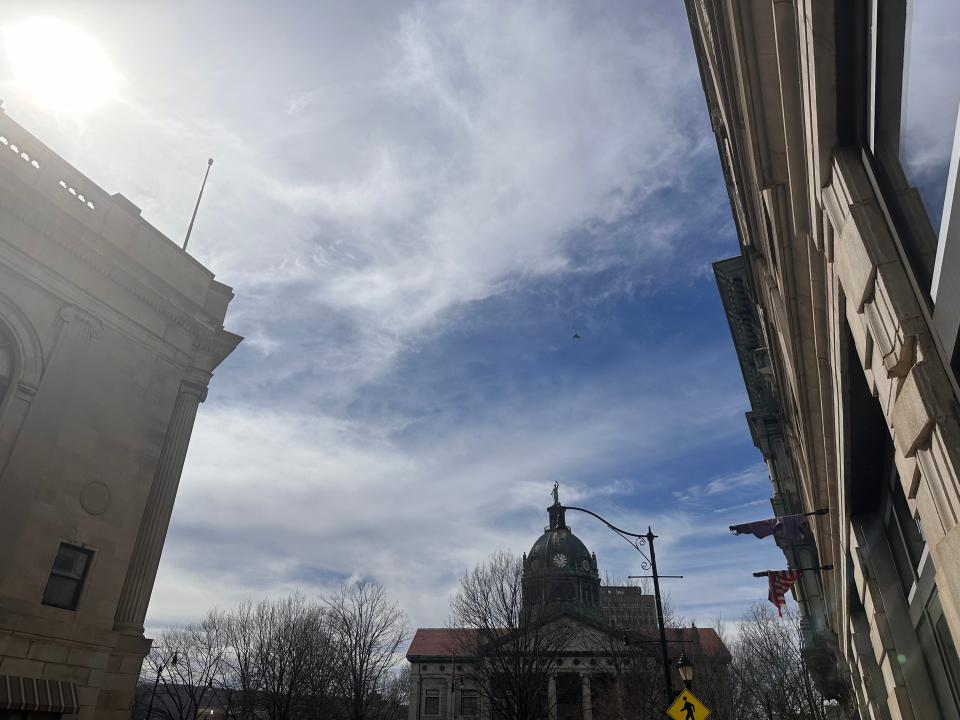 Blue skies with clouds rolling over downtown Binghamton Monday morning, April 8, 2024.