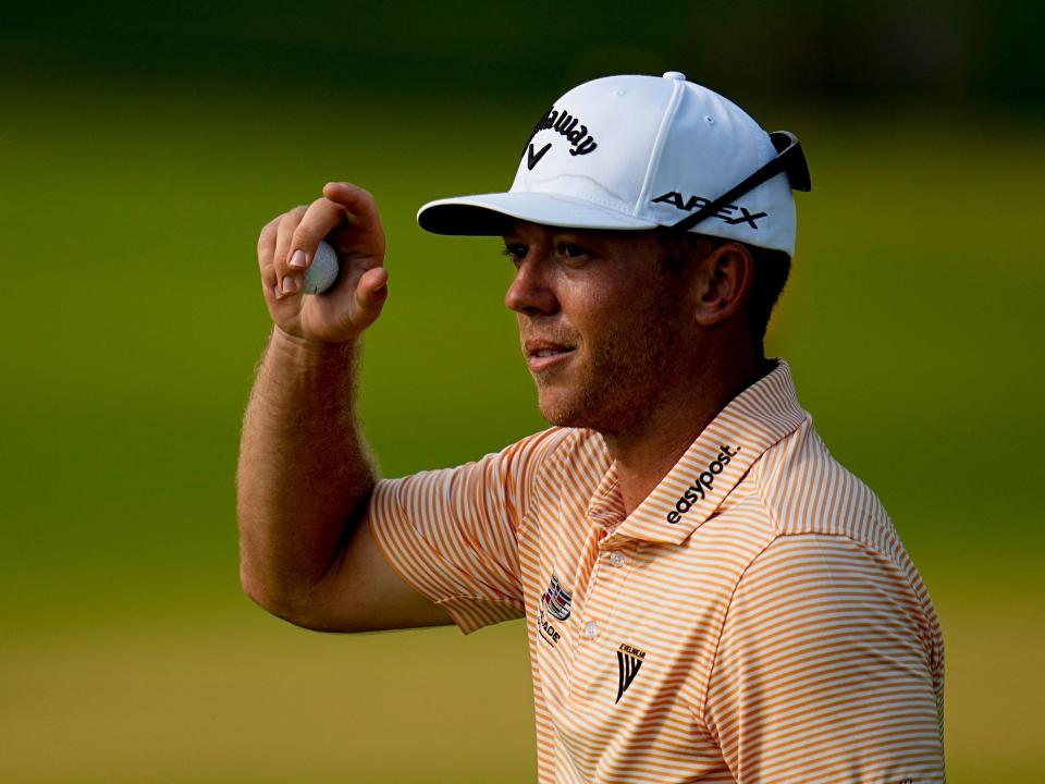 Talor Gooch tips his cap after sinking his putt on the 9th hole at the 2022 PGA Championship.