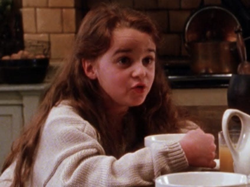 antonia sitting at the kitchen island in practical magic