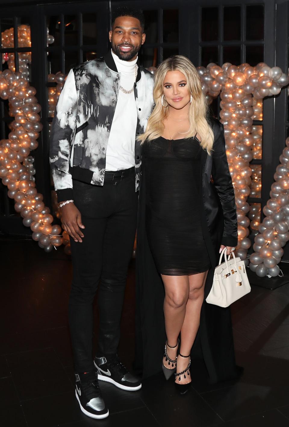 Tristan Thompson and Khloe Kardashian pose for a photo as Remy Martin celebrates Tristan Thompson's Birthday at Beauty & Essex on March 10, 2018 in Los Angeles, California