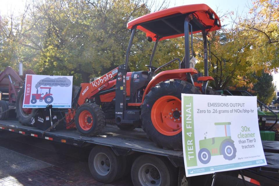 Several tractors, harvesters, utility task vehicles and other low-emission pieces were displayed outside Modesto Centre Plaza on Wednesday, Nov. 29, 2023, for a clean air ag equipment showcase.