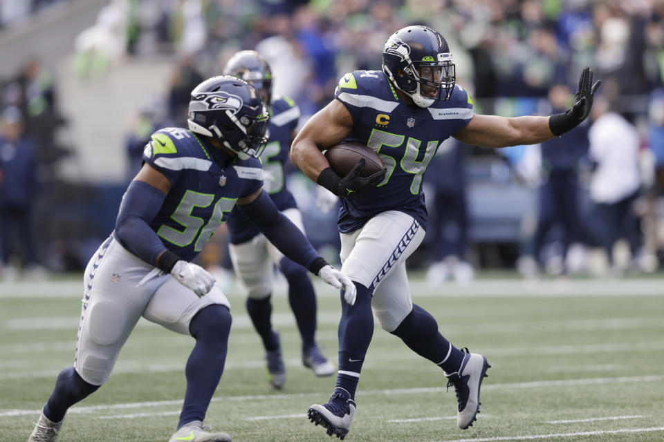 Seattle Seahawks middle linebacker Bobby Wagner (54) runs with the ball after intercepting a pass against the San Francisco 49ers during the first half of an NFL football game, Sunday, Dec. 5, 2021, in Seattle. (AP Photo/John Froschauer)