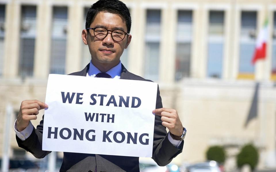 Exiled student activist Nathan Law shows his support outside the Italian Ministry of Foreign Affairs - RICCARDO ANTIMIANI/EPA-EFE/Shutterstock /Shutterstock