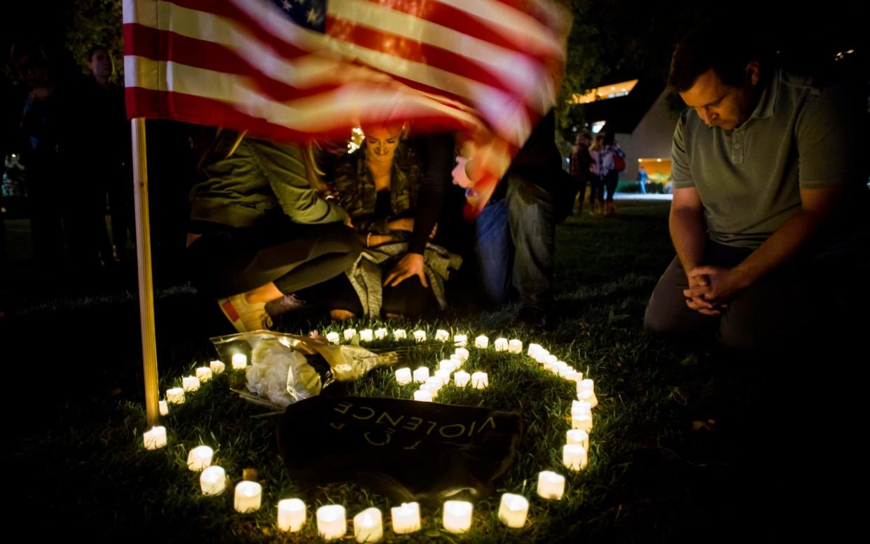 Mourners at a vigil in Thousand Oaks, California - AFP