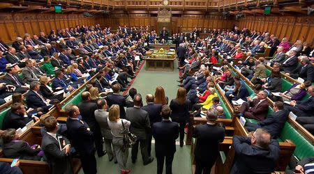 Britain's Prime Minister Theresa May addresses the House of Commons on her government's reaction to the poisoning of former Russian intelligence officer Sergei Skripal and his daughter Yulia in Salisbury, in London, March 14, 2018. Parliament TV handout via REUTERS