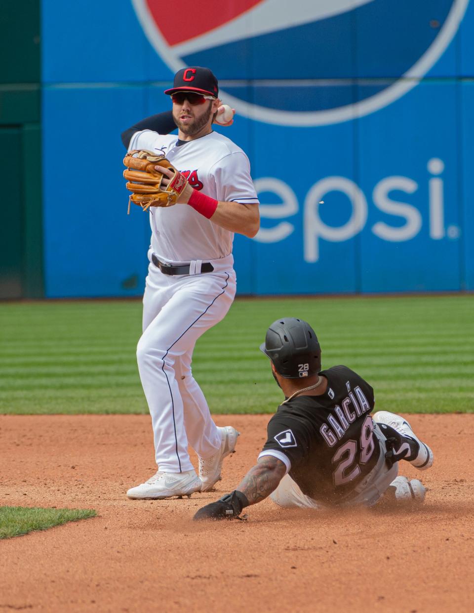 Cleveland's Owen Miller throws to first base to complete a double play against the White Sox last season.