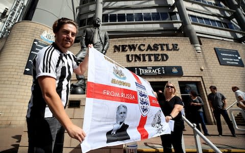 Newcastle United fans with a 'From Russia With Love' England flag - Credit: PA