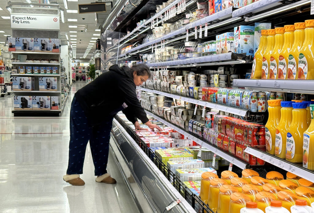 A shopper looking at food in an aisle