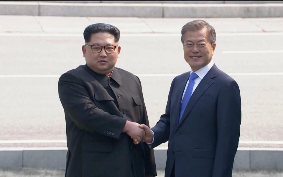 Kim Jong-un shakes hands with Moon Jae-in. Source: Reuters