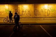 <p>A business at a strip mall near Minneapolis Police Department’s Fifth Precinct building is boarded up. </p>