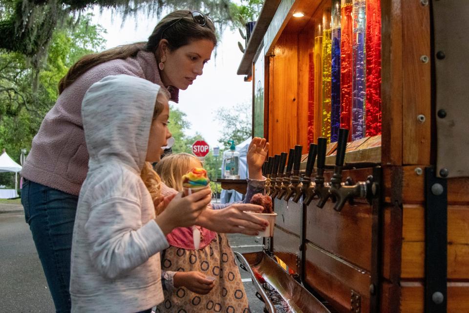 Thousands of Tallahasseeans gather downtown despite the rain to enjoy the Tallahassee Jubilee festivities Saturday, April 2, 2022. Unfortunately the thunder and lightning prevented the parade from being able to start.