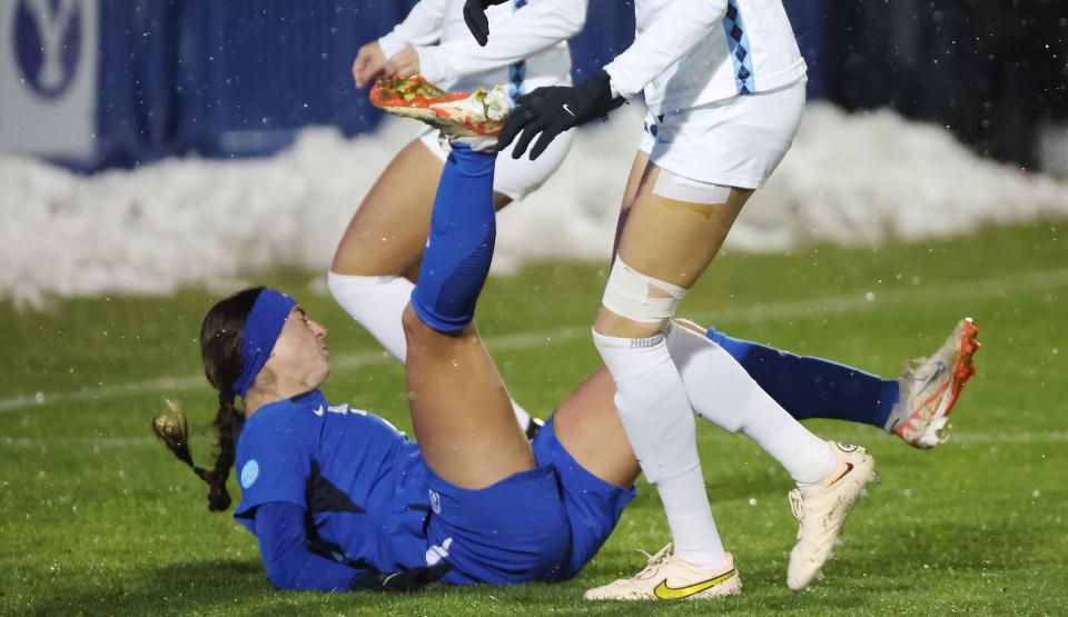 BYU midfielder Bella Folino (22) falls trying to head the ball against North Carolina during the NCAA tournament quarterfinals in Provo on Friday, Nov. 24, 2023. | Jeffrey D. Allred, Deseret News