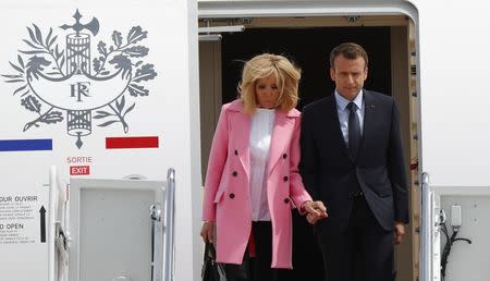 French President Emmanuel Macron and his wife Brigitte Macron arrive for their state visit to Washington and meetings with U.S. President Donald Trump after landing at Joint Base Andrews in Maryland, U.S. April 23, 2018. REUTERS/Brian Snyder