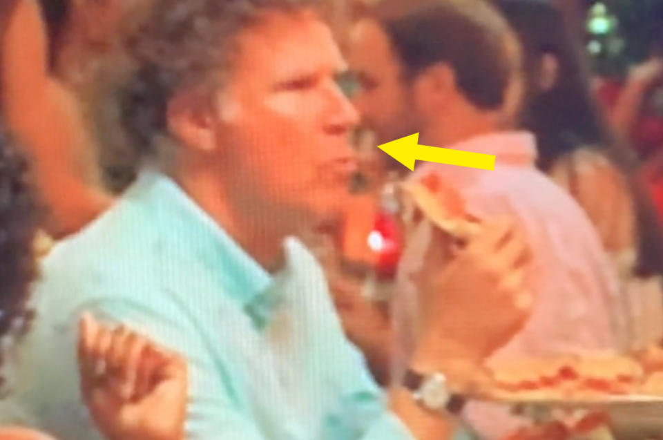 Close up of Will Ferrell eating pizza in the nackground