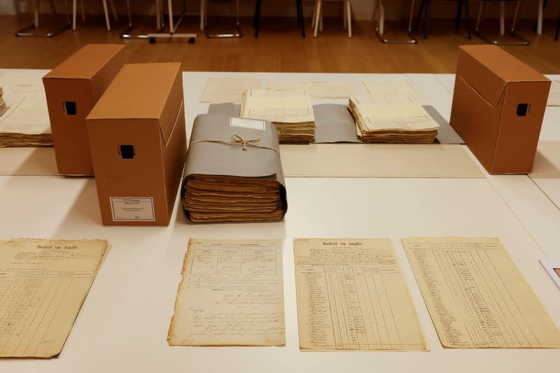 Documents showing statement of declaration on the plantation Nurserij on the Nickerie River in Suriname are displayed at the National Archive in The Hague