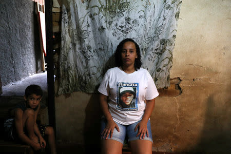 Janaina Mattos Alves, mother of Jonatha Dalber, poses for a photo at her home in the Borel slum in Rio de Janeiro, Brazil, April 22, 2018. Mattos said her son was was shot dead by the police in 2016 when he was 16-years-old. REUTERS/Pilar Olivares
