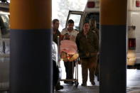 An Israeli medic wheels a soldier, one of six wounded in what the Israeli military said was Friday's second Palestinian car ramming attack in the West Bank, to a hospital in Jerusalem November 27, 2015. REUTERS/Ammar Awad