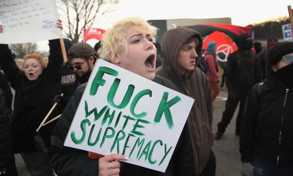 Demonstrators clash with police before the start of a speech by the white nationalist Richard Spencer at Michigan State University.