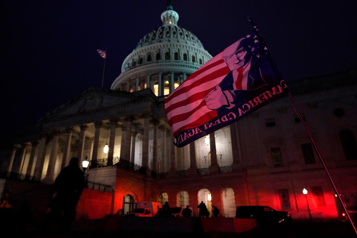 Authorities stand guard outside the U.S. Capitol after supporters of President Donald Trump gathered on Wednesday, Jan. 6, 2021, in Washington.