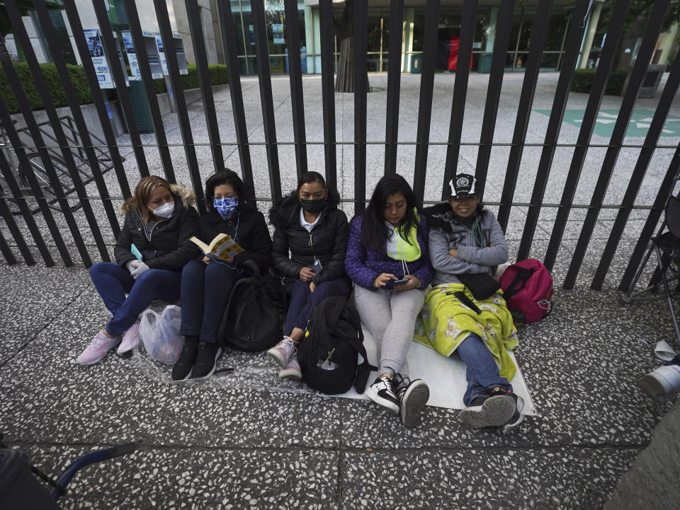 Unionized Telmex workers join an indefinite strike for better working conditions outside the Mexican telecommunications company headquarters in Mexico City, Friday, July 22, 2022. (AP Photo/Marco Ugarte)