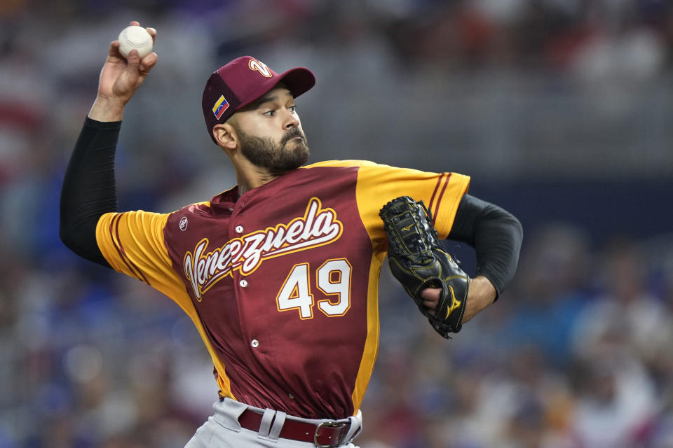 Venezuela's Pablo Lopez (49) delivers a pitch during the first inning of a World Baseball Classic game against Puerto Rico, Sunday, March 12, 2023, in Miami. (AP Photo/Wilfredo Lee)