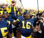 ANN ARBOR, MI - NOVEMBER 17: Denard Robinson #16 of the Michigan Wolverines celebrates a 42-17 victory over the Iowa Hawkeyes Michigan Stadium on November 17, 2012 in Ann Arbor, Michigan. (Photo by Gregory Shamus/Getty Images)