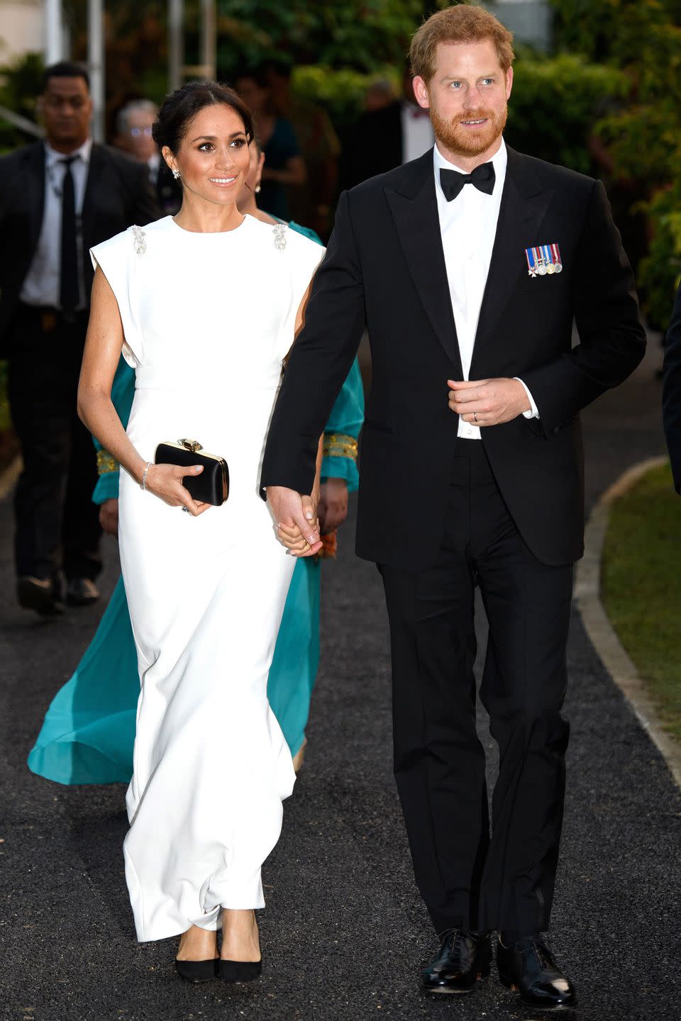 <p><strong>October 2018 </strong>For a reception and dinner at the palace in Nuku'alofa, Tonga, the duchess wore a white Theia gown with a Givenchy clutch and her favourite Tabitha Simmons sling-backs.</p><p><a rel="nofollow noopener" href="https://www.neimanmarcus.com/en-gb/p/theia-cap-sleeve-beaded-silk-satin-column-gown-navy-prod195610106" target="_blank" data-ylk="slk:SHOP THE DRESS;elm:context_link;itc:0;sec:content-canvas" class="link ">SHOP THE DRESS</a></p><p><a rel="nofollow noopener" href="https://www.givenchy.com/gb/en/satin-clutch-with-jewelry-clasp/BB5014B02F-001.html" target="_blank" data-ylk="slk:SHOP THE BAG;elm:context_link;itc:0;sec:content-canvas" class="link ">SHOP THE BAG</a></p><p><a rel="nofollow noopener" href="https://www.bloomingdales.com/shop/product/tabitha-simmons-womens-millie-slingback-pointed-toe-pumps" target="_blank" data-ylk="slk:SHOP THE SHOES;elm:context_link;itc:0;sec:content-canvas" class="link ">SHOP THE SHOES</a></p>