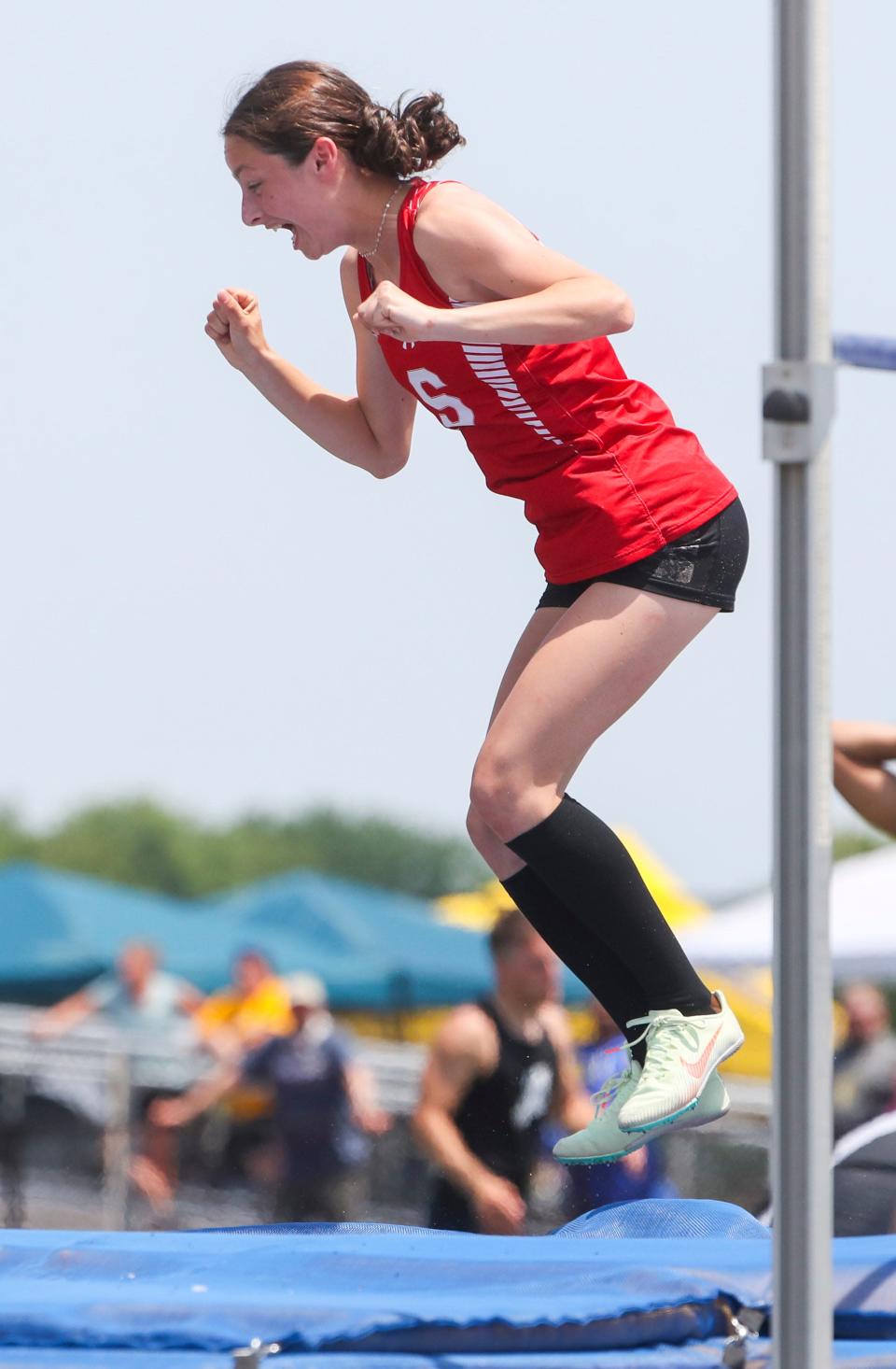 Smyrna's Brooke Duke reacts after clearing 5' 6&quot; on her first attempt at that height to win the Division I high jump during the DIAA state high school track and field championships Saturday, May 22, 2022 at Dover High School.