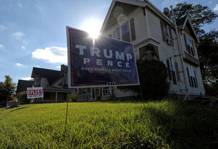 An election sign supporting U.S. Republican presidential nominee Donald Trump stands in front of a home in Atchison, Kansas October 21, 2016. REUTERS/Dave Kaup