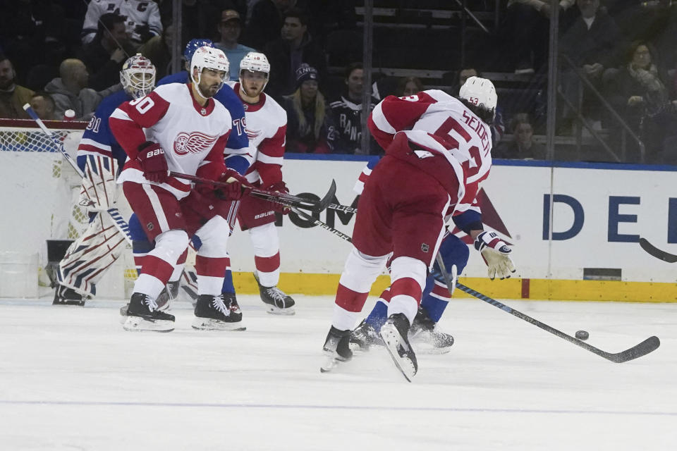 Detroit Red Wings' Moritz Seider, right, shoots and scores during the second period of an NHL hockey game against the New York Rangers, Wednesday, Nov. 29, 2023, in New York. (AP Photo/Bebeto Matthews)