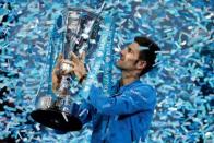 Tennis - Barclays ATP World Tour Finals - O2 Arena, London - 22/11/15 Men's Singles Final - Serbia's Novak Djokovic celebrates with the trophy after winning the Barclays ATP World Tour Finals against Switzerland's Roger Federer Reuters / Suzanne Plunkett Livepic