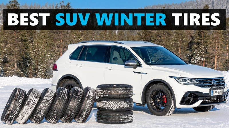 Winter SUV tires lined up in the snow in front of a Volkswagen Tiguan R