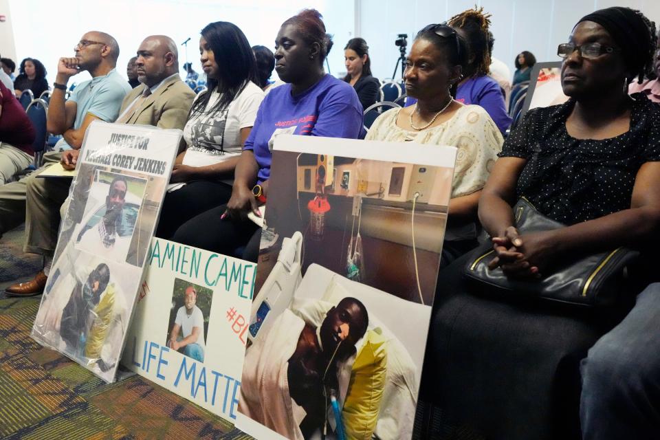 The families of Michael Corey Jenkins and Damien Cameron sit together prior to interacting with U.S. Assistant Attorney General Kristen Clarke (not shown), of the Justice Department's Civil Rights Division, during a Jackson, Miss., stop on the division's civil rights tour Thursday, June 1, 2023.