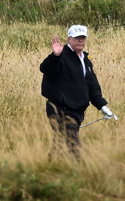 Give us a wave, Donald! - Credit: AFP
